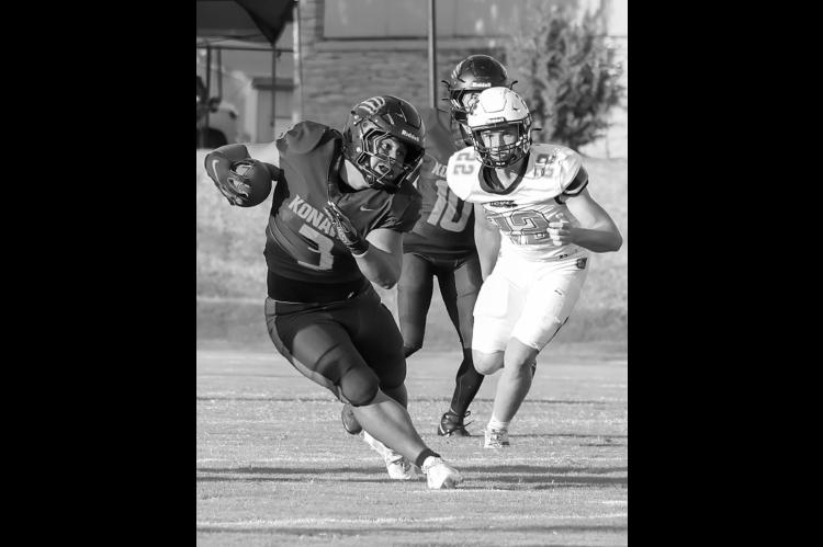 Courtesy Photo by Glen Bryan Konawa Tiger Quentin Shaw finds a running lane through the defense.