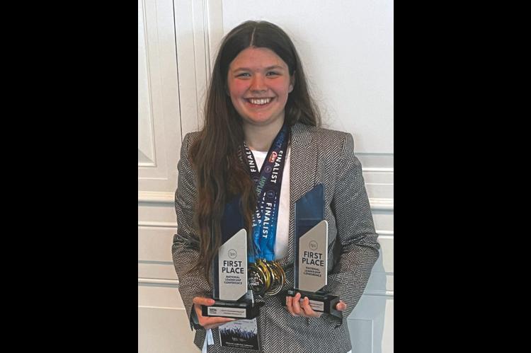 Pictured above is Xadonia Laughlin with the hardware she claimed at the BPA National Leadership Conference. She secured top honors in several technical disciplines and will officially begin her first professional IT position with the GO Consulting team this June. (Photo provided)