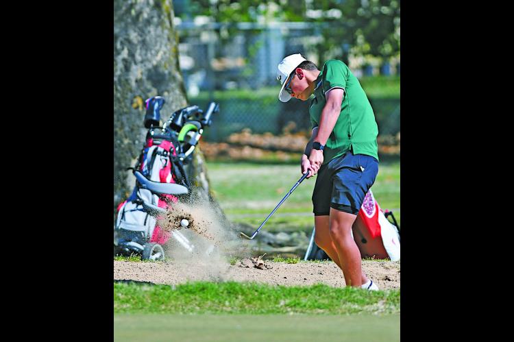 Seminole Chieftain Tre Hasbell uses a wedge to get out of a trap in the tournament. Courtesy Photo by Brian Blansett