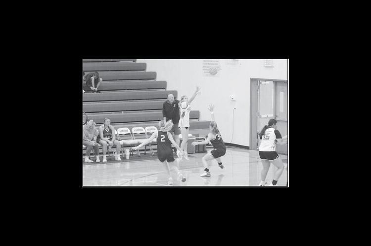 Courtesy Photo by Jeanne Gosa Varnum Lady Whippet Kenzlee Houck shoots the 3-point jumper against Regent Prep Thursday.