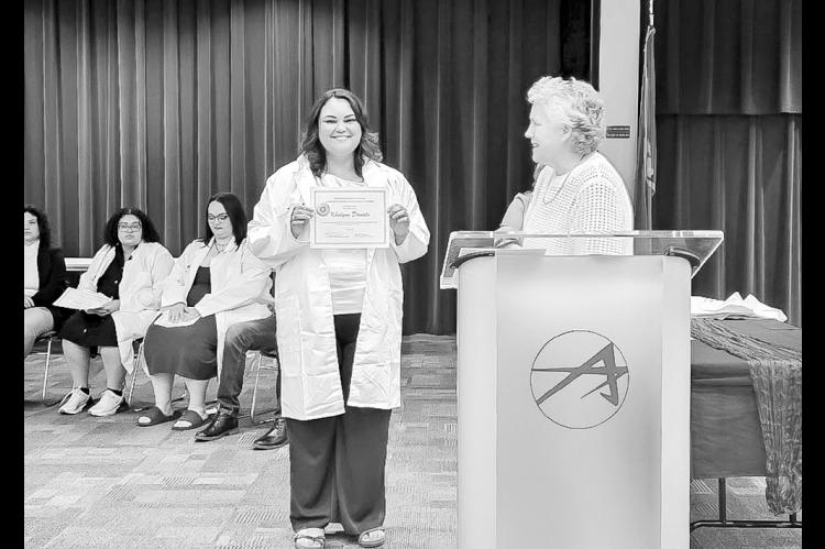 Seminole State College Medical Laboratory Technology student Khalynn Daniels poses for a photo with MLT Program Director Kelly Hankle during the program’s White Coat Ceremony. The event was held May 7 at Gordon Cooper Technology Center in Shawnee, Oklahoma. The ceremony honored graduates of the MLT program’s Class of 2026 which includes Lucas Blevens, Evan Fry, Avery Johnson, Isabella Bible, Khalynn Daniels, Jaelynn Robertson, Lacy Haynes and Angelina Sims. (SSC photo)