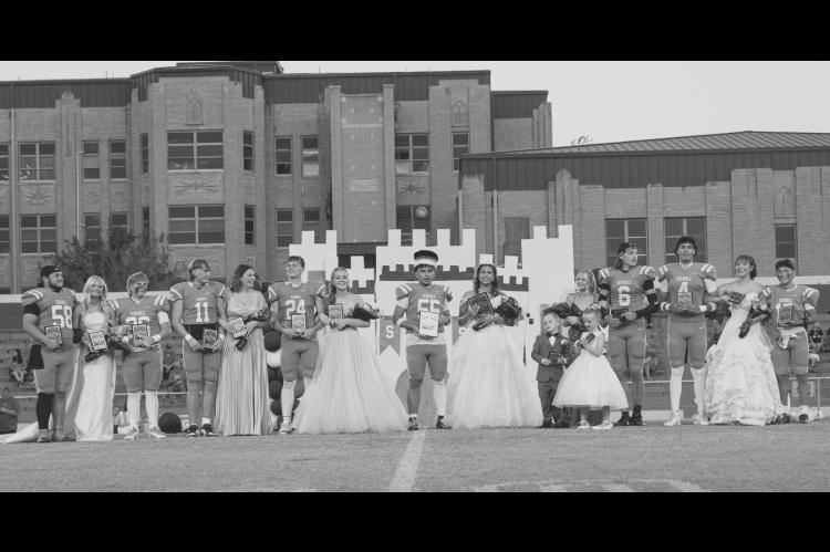 The 2026 Seminole High School Homecoming Court was revealed Friday night. L-r: Carsie Gorman, Sophomore Attendant Maggie Tucker, Ty Womack, Jaxon Williams, Sr. Attendant Maya Wilson, Carter Childs, Maid of Honor Landree Giles, King Aidan Napier, Queen Tafv Stewart, Crown Bearer Cash Dobson, Flower Girl Harper Anderson, Senior Attendant Daisy Wood, Cashawn Thompson, Dariane Loya, Jr. Attendant Adyson Coon and Alan Abrego. —Photo by Ben Schatzel