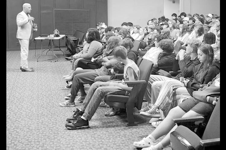 District Judge Brett W. Butner speaks to students at Butner School during a Law Day assembly on April 23. Lawyers and judges spoke to assemblies at several area schools in an effort to promote civics education. Law Day was observed in Seminole County and throughout the state and nation on May 1. (Courtesy photo)