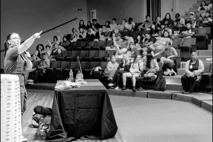 Left, Danielle Boyer, citizen of the Sault Ste. Marie Tribe of the Chippewa, speaks at the Jeff Johnston Fine Arts Auditorium on June 16. Her presentation, titled “Opportunities Through STEM,” highlighted her work in youth robotics and efforts to pres