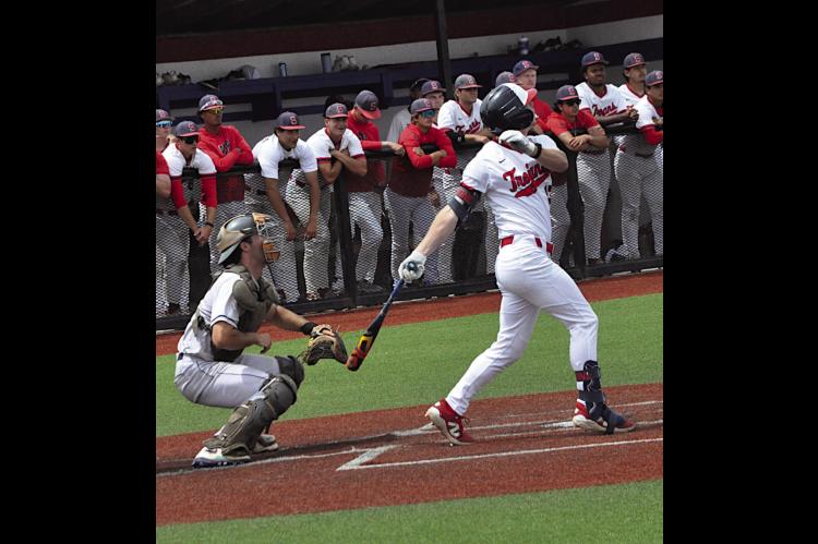 Seminole State Trojan Guillermo Castaneda hits a pop fly Thursday afternoon. Staff Photo by Bill Anderson