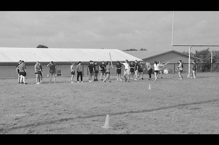 Staff Photo by Bill Anderson COMMERCIAL PROPERTY-MUSTANG, OKLA. Strother Lady Yellowjackets gather outside at the football field to run drills and other skills challenges during Summer Pride.