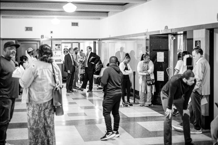After roll call, tenants, landlords and attorneys meet outside the courtroom. (Jake Ramsey/Oklahoma Watch)