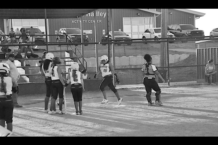 Varnum Lady Whippet Miley Wildcat hits an inside homerun Tuesday evening. Staff Photo by Bill Anderson