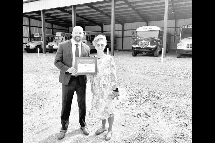 U.S. Department of Agriculture Rural Development Oklahoma State Director Zachary Swartz presents a $50,000 grant award to Rhonda Barkhimer, Superintendent of New Lima Public Schools. The grant, part of a $4.2 million investment in rural Southeast Oklahoma