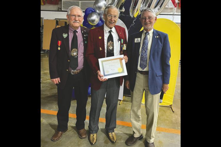 Above, Wewoka Lions Club member and Past District Governor Ferril Williamson receives an International President’s Certificate at a special dinner held last Saturday in commemoration of the club’s 100th anniversary. (Courtesy photo)