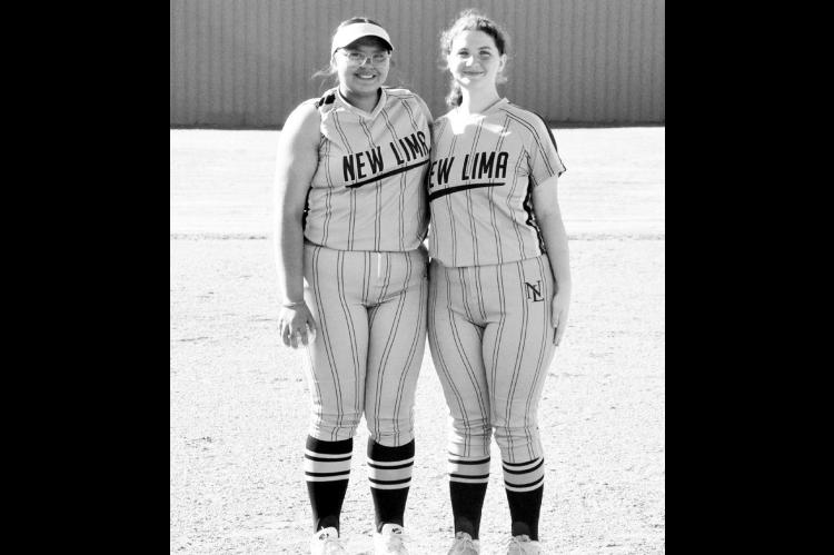 —Staff Photo by Bill Anderson Abygail McCulley and Karli Johnson, both seniors on the New Lima Falconettes softball team, were honored before Monday’s game with Wewoka. New Lima won by a score of 13-5. Game details are on page 5.