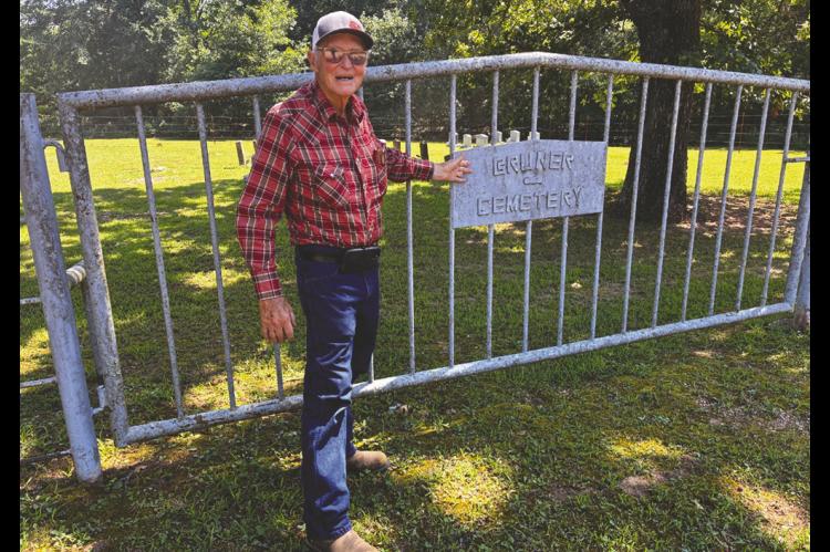 Eighty-nine-year-old Billy Joe “BJ” Isaacs, a graduate of Konawa High School, at the gate of Bruner Cemetery in Seminole County. Isaacs has been anonymously maintaining for the cemetery for more than two decades. —Photo by Bob Melton