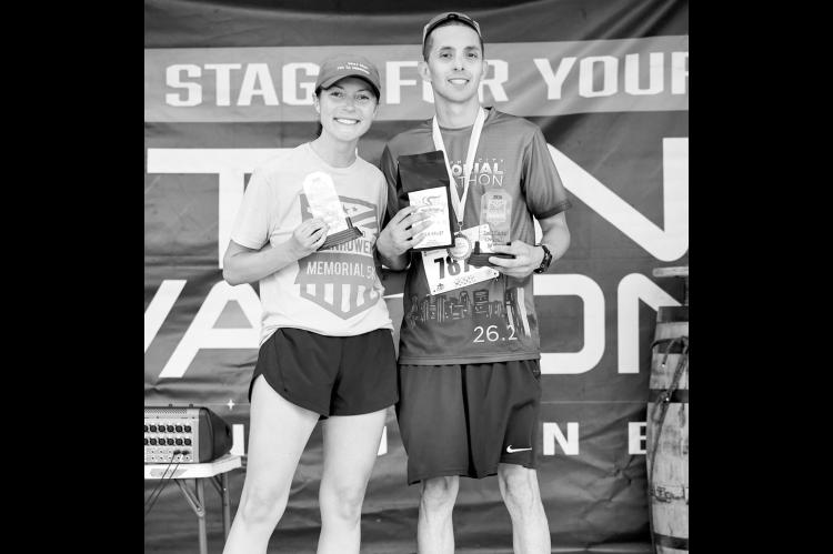 The 13th Annual Sgt. Bret Isenhower Memorial 5K was held Saturday in downtown Seminole. The event’s founder, Krysten Isenhower (left), was the overall woman winner with a time of 22:24. Mikal Verdine (right) was the overall male winner with a time of 18:25. The race honors Bret Isenhower, a Seminole High School graduate who was killed in action in 2011. (Courtesy photo)