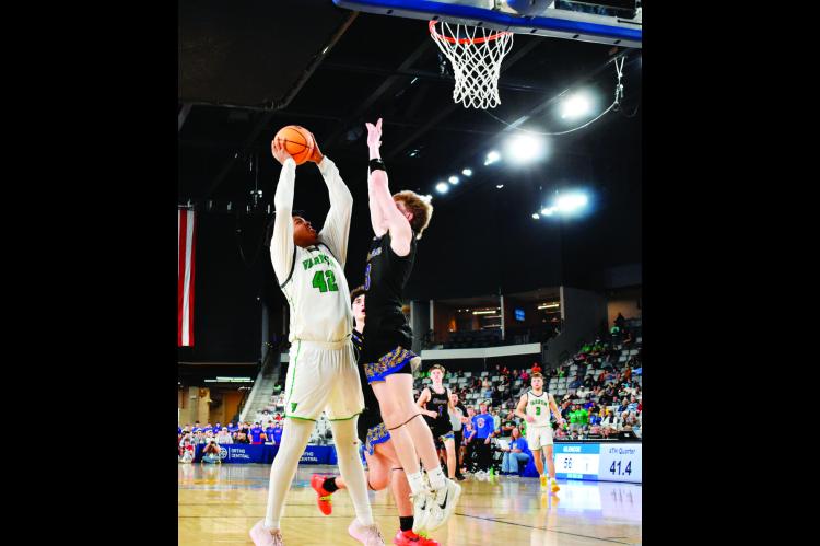 Above, below: Varnum Whippet Jon Madkin and a Glencoe defender battle for the ball underneath the basket at the OG&amp;E Coliseum Thursday evening. The Whippets defeated Glencoe 61-58. —Staff Photos by Andy Wilson