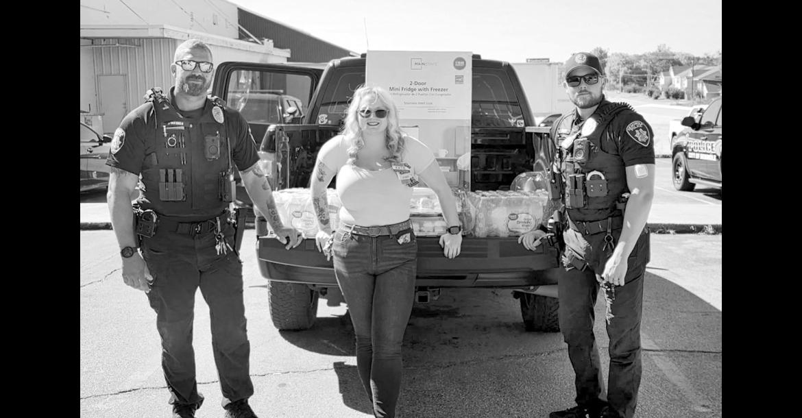 The summer heat just doesn’t seem to want to lessen its grip, so Seminole Walmart wanted to make sure local police officers keep cool while they’re working. The store donated a mini fridge, cases of water and sandwiches to the Seminole Fraternal Order of Police to help keep officers fed and hydrated on the job. Pictured with Walmart employee Katie are Officers Bohannon and Sanor. —Courtesy photo