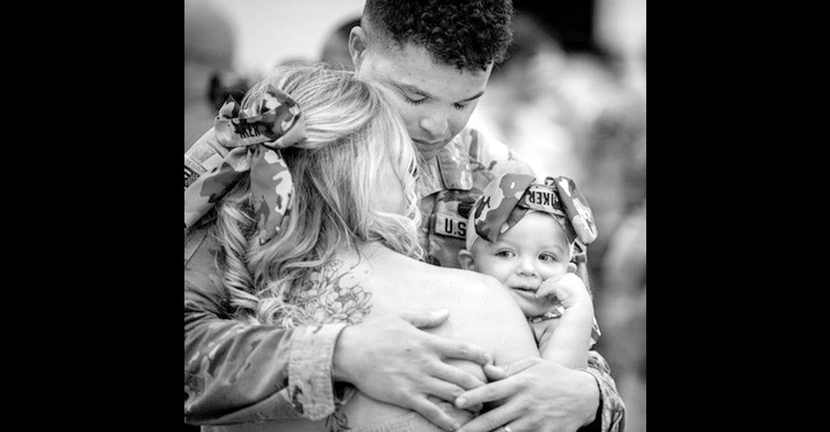 An Oklahoma Army National Guard Soldier assigned to the 745th Military Police Detachment, 345th Combat Sustainment Support Battalion, 90th Troop Command, Oklahoma Army National Guard, hugs his family during the unit’s welcome home ceremony in Mustang, Oklahoma, Aug. 20, 2026. The Citizen-Soldiers reunited with loved ones during a welcome home ceremony honoring the unit’s nine-month deployment to the U.S. Central Command area of responsibility. (Oklahoma National Guard photo by Anthony Jones)