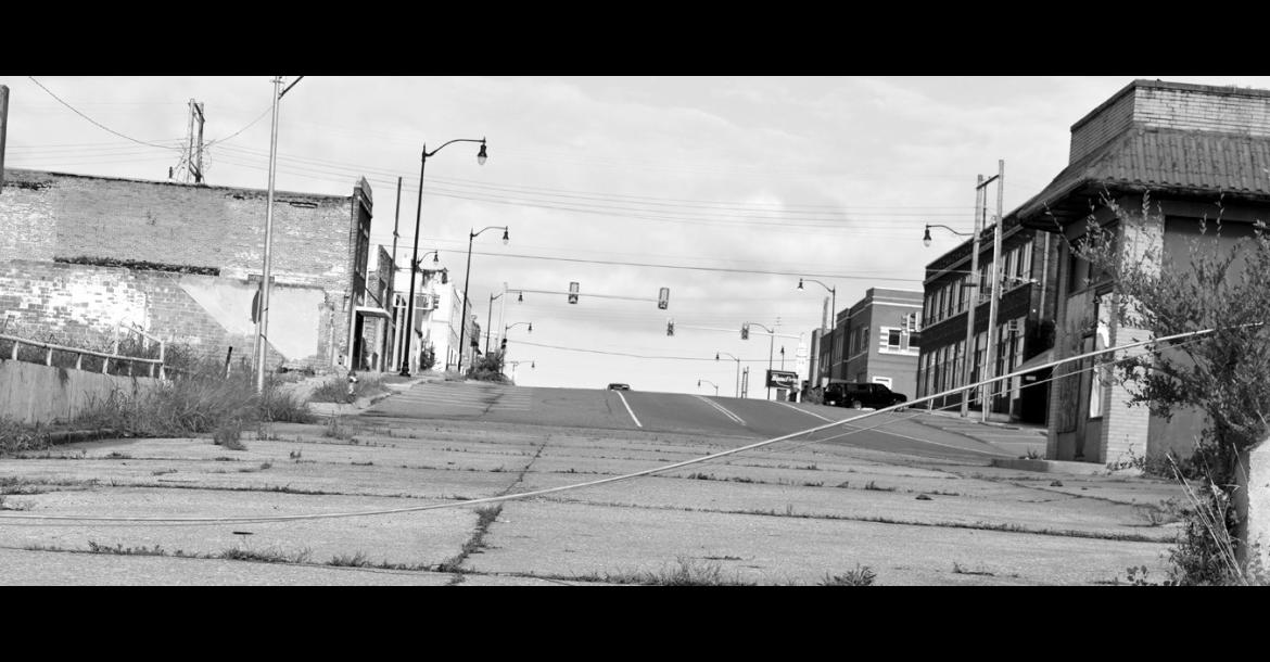 A downed power line lies across the roadway near the former Bus Station Café in Seminole Monday morning following a storm that delivered powerful winds across much of Oklahoma in the pre-dawn hours. The Derecho knocked down multiple trees and left thousands of customers without electricity. Those who sustained damage to their homes or businesses are encouraged to report it online at damage.ok.gov. (Staff photo by Andy Wilson)