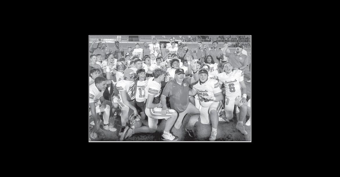 Coach Mike Snyder and the Seminole Chieftains celebrate on the sidelines after the team’s 46-23 victory over NW Classen Friday night. Friday’s win was Snyder’s 400 t ' 1 career win. Snyder started with Seminole Public Schools in 1972 and became head football coach in 1980. —Staff Photo by Bill Anderson