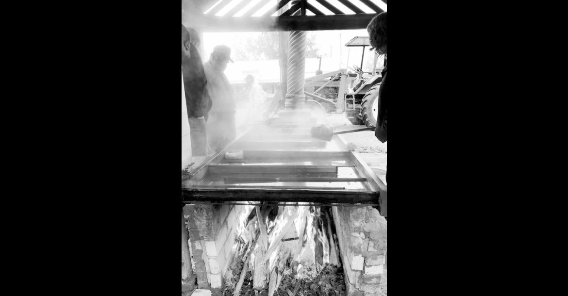 Steam rises from the pan as raw cane juice slowly caramelizes into sorghum syrup in this undated photo from the Wewoka Sorghum Festival. The woodfired furnace is integral to the process of making the centuries-old sweetener. A grant from ORRC will help prolong the life of the historic structure located on the grounds of the Seminole Nation Museum in Wewoka. (Photo provided)