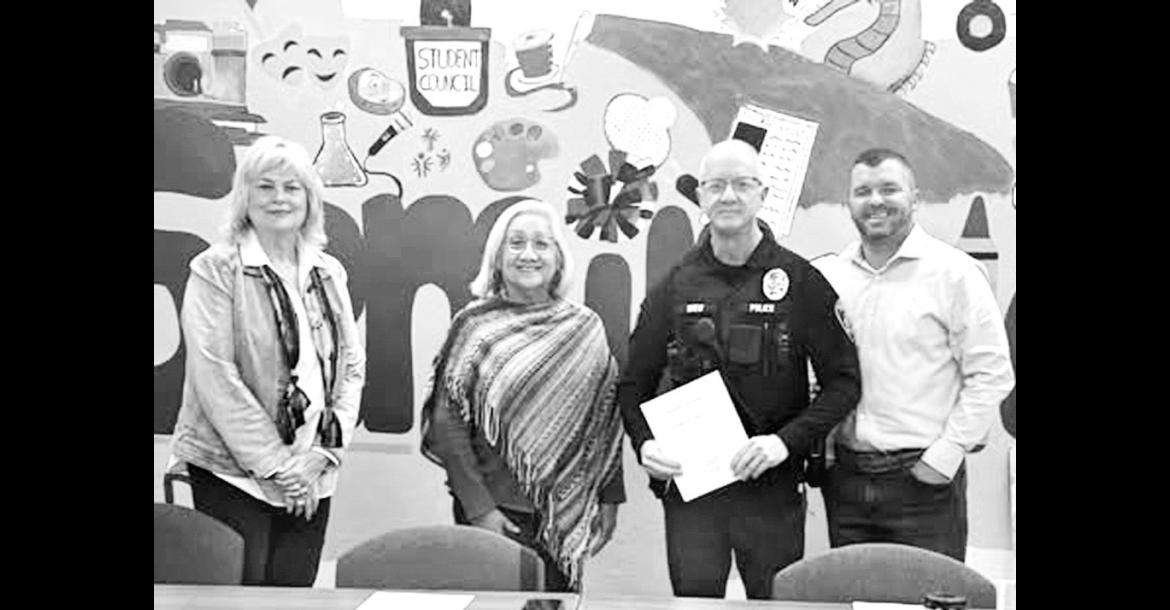 Seminole Public Schools Resource Officer John Boy Drew (third from left) was recognized Oct. 20 by the Seminole School Board for his actions in averting a potentially life-threatening situation involving a reckless driver last month. Also pictured are school board members Claudia Willis, Lisa Cobb and Tyler Geohagen. (Courtesy photo)