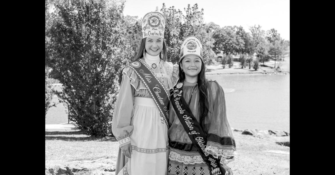 Miss Choctaw Nation Mia Reich (left) and Miss Seminole Nation Alivia Wapskineh stand in front of the south pond on Seminole State College’s campus. Both are President’s Leadership Class scholarship recipients who balance campus involvement with service to their tribal communities. (Photo provided)