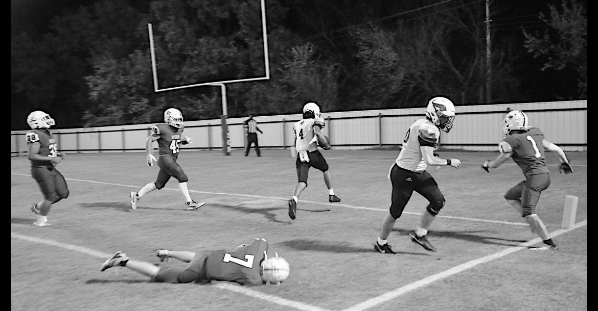 Sasakwa Viking Titan Collins gets away from the Bowlegs defender for the touchdown. Staff Photo by Bill Anderson