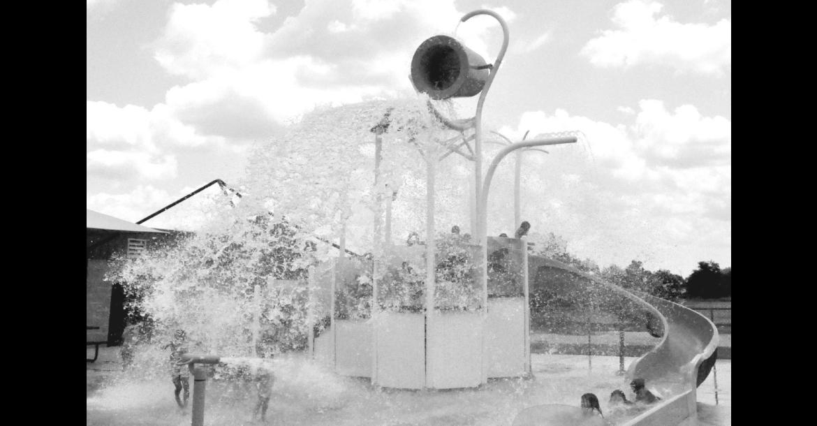 In this file photo from 2024, cool refreshing water gets dumped on children as they play in Seminole’s Splashpad, located in the municipal park. City officials announced Tuesday that the popular water attraction will be closed all day this Saturday, July 4. The annual fireworks display is typically launched from an area near the splashpad beginning at dusk. —File photo