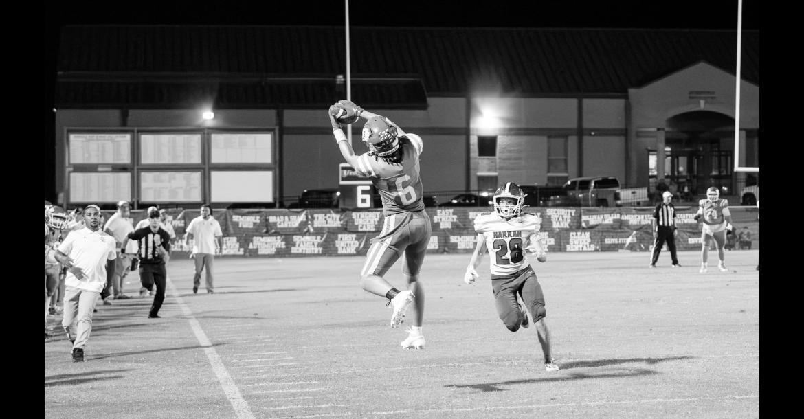 Seminole Chieftain Cashawn Thompson catches a pass for a big gain Friday night at home against Harrah Courtesy Photo by Ben Schatzel