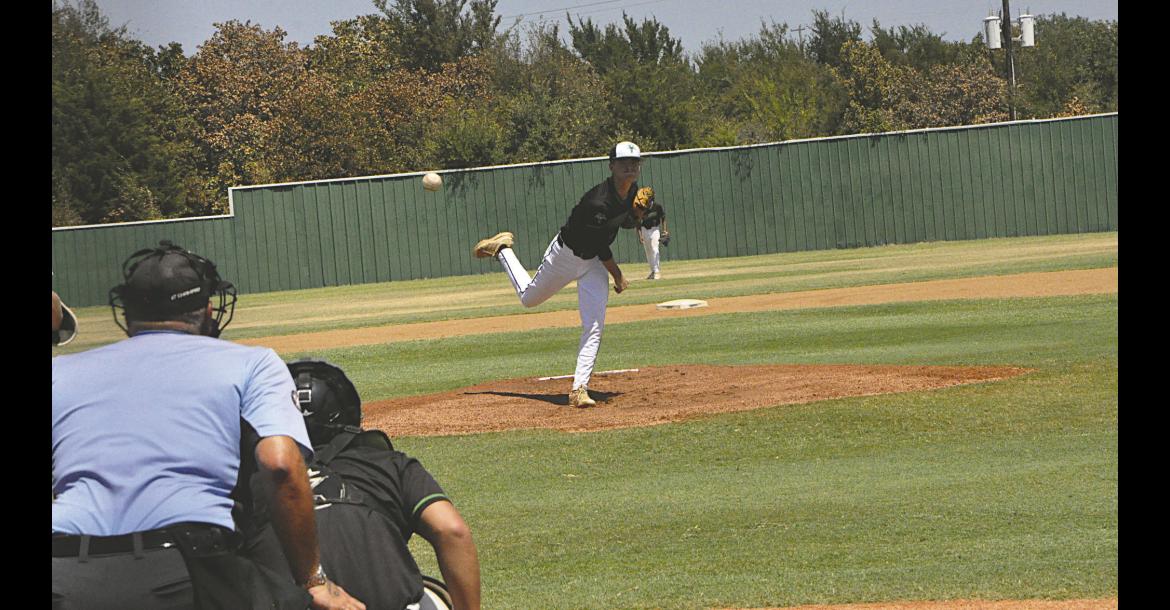 Varnum Whippet Cooper Smith throws the Heater to the waiting batter Thursday. Staff Photo by Bill Anderson