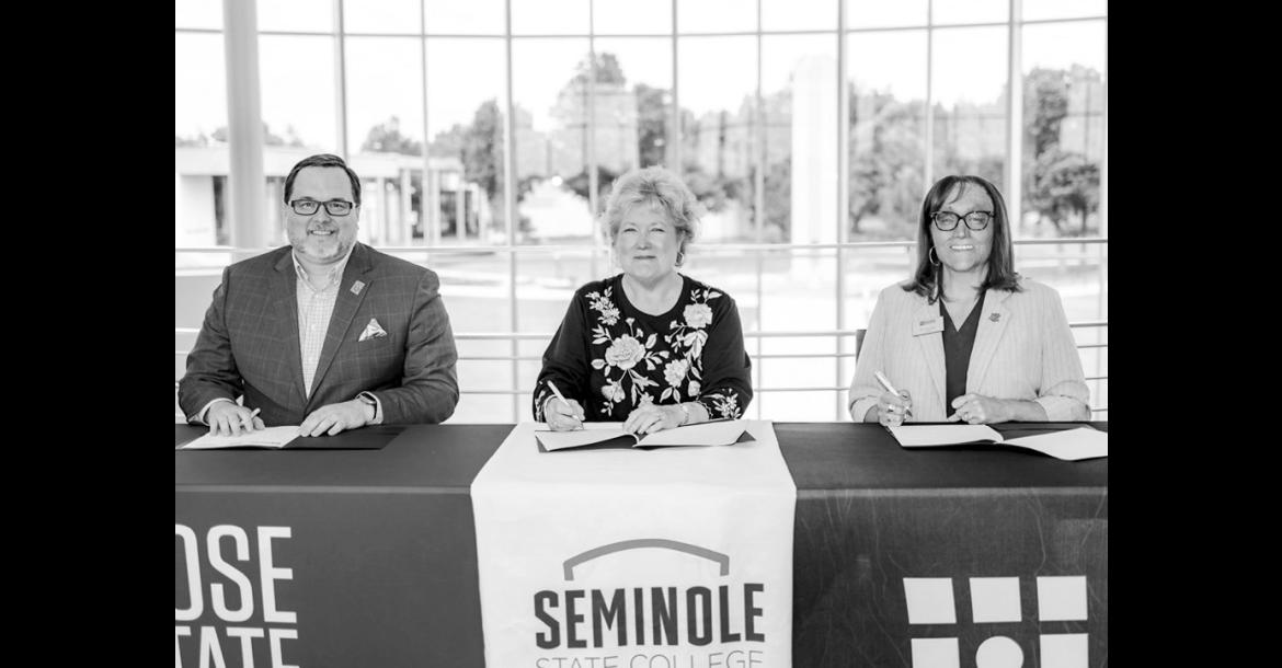 Rose State College President Travis Hurst, Seminole State College President Lana Reynolds and Redlands Community College President Jena Marr sign a memorandum of understanding June 2 at Rose State College. The agreement allows the three institutions to share professional library services beginning July 1, 2026. (Courtesy photo)