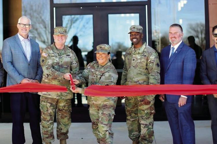 Seminole Natives Brig. Gen. Brad Carter and Col. Lindy White (holding scissors), and Capt. E.J. Johnson, Oklahoma Army National Guard, are joined by Okla. Representative Chris Kannady, Flintco Construction, Larson Design Group, and Oklahoma Army National 