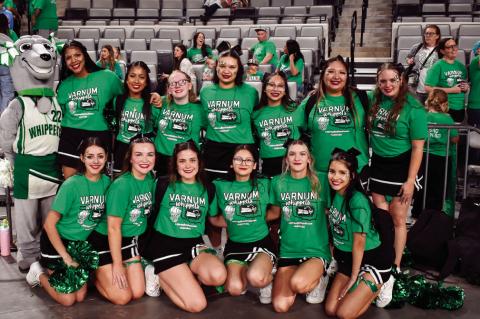 Above left, the Varnum cheerleaders, along with their Whippet mascot, pose for a group photo at the OG&amp;E Coliseum in Oklahoma City Thursday evening. Right, the stands were a sea of green as supporters cheered on the boys basketball team in the Class Z