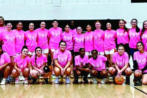Konawa hosted Wewoka Monday night for their “Pink Out” game for Breast Cancer Awareness. Pictured on top row is Konawa cheer and basketball team and bottom row is the Wewoka basketball team. Courtesy Photo by Don Gallagher