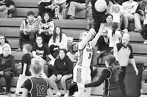 Varnum Lady Whippet Raylin Gee takes a short from behind the arch Friday. Staff Photo by Andy Wilson