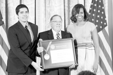 Above, Dr. Michael Mares receives the National Medal on behalf of the Sam Noble Museum from Michelle Obama. Mares was recently inducted into the Oklahoma Hall of Fame by Seminole Native Reggie Whitten. (Photo provided)