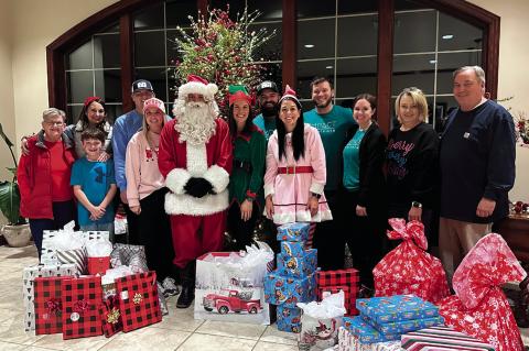 Impact Seminole, a local nonprofit, was able to sponsor 12 local children this Christmas with the help of numerous families and Women of Faith from First United Methodist Church. Santa, District Judge Brett Butner, and his elves delivered the gifts direct