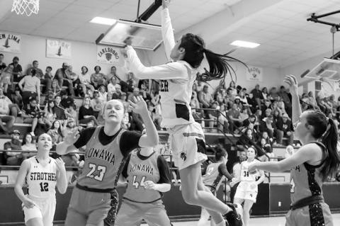 Strother Lady Yellowjacket Danica Morales puts up a basket attempt over the defensive effort of Konawa’s Kakie Jencik. Courtesy Photo by Glen Bryan