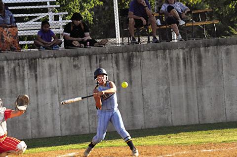 New Lima Falconette Krissy Griffis knocks the ball into the outfield Thursday. Staff Photo by Bill Anderson