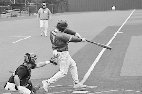 Seminole Chieftain Maverick Northrip knocks the ball into the outfield Friday. Staff Photo by Bill Anderson