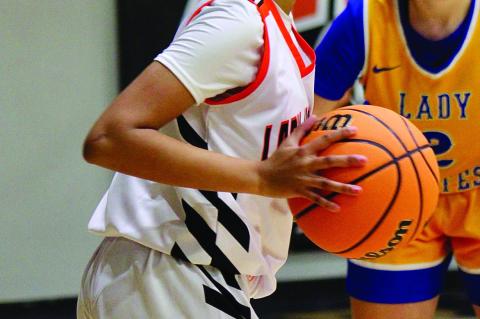 Strother Lady Yellowjacket KK Murray looks for an open teammate Thursday. Courtesy Photo by Geneva Reynolds