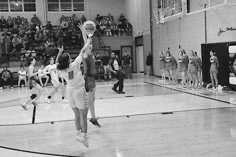 Wewoka Lady Tiger Aubrey Alexander shoots around the Vanoss defender Monday night. Lady Tigers lost 46-71 Staff Photo by Bill Anderson