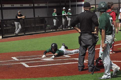 Seminole Chieftain JJ Hair slides into home Wednesday against the Prague Red Devils. Staff Photo by Bill Anderson