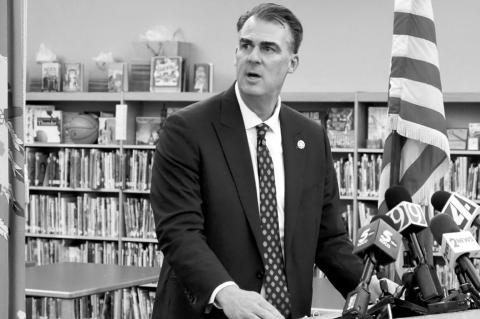 Gov. Kevin Stitt speaks in the school library of Eisenhower International School in Tulsa on Oct. 2. (Photo by Nuria Martinez-Keel/Oklahoma Voice)