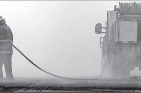 A firefighter works to extinguish a raging wildfire on the west side of Stillwater in early March 2025. (Photo by Mitchell Alcala, OSU Agriculture)