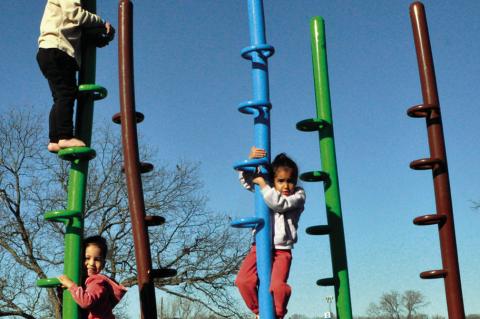 Chance Morgan, Royalty Moore and Joey Moore took advantage of Wednesday’s unseasonably warm temperatures by climbing around in Boom Town Playground, located in the Seminole Municipal Park. —Staff Photo by Bill Anderson