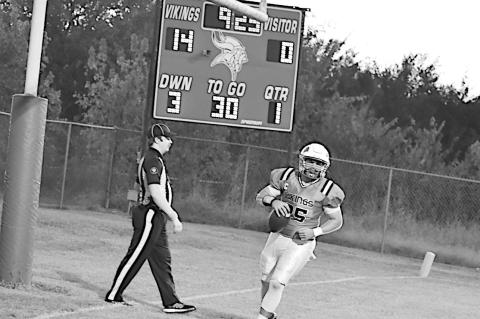 Staff Photo by Andy Wilson Sasakwa Viking Joseph Lunn runs in another touchdown for the Vikings Friday night against Midway.