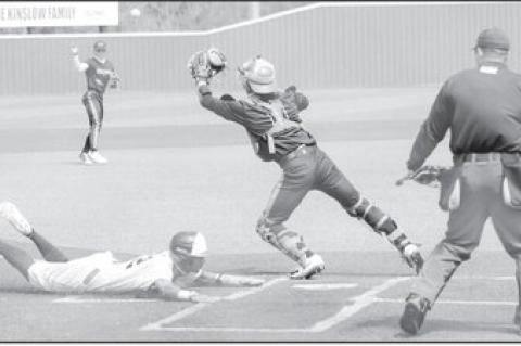 Safe at Home Courtesy Photo by Glen Bryan SSC’s Jaylon Humbles beats the throw to the catcher for the Trojan score.