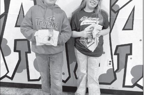 Left, the Academy of Seminole Middle School Students of the Month are Sullinan Larney and Brooklyn Wells. High School Students of the Wedth are Lexi Rivera and Jared Betancourth-Gaspar (not pictured).