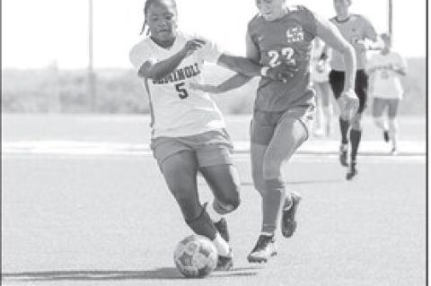 Seminole State Lady Trojan Fredricka Finnikin gets control of the ball as she approaches the goal. Courtesy Photo by Glen Bryan