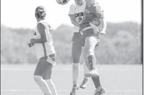 Seminole State Lady Trojan Emma Fanous battles a Lady Buck defender for the ball. Photo by Glen Bryan